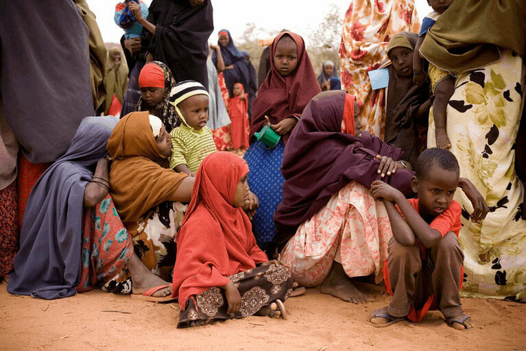 Women and children at WFP distribution center in Somalia receiving food assistamce in response to the drought in this region