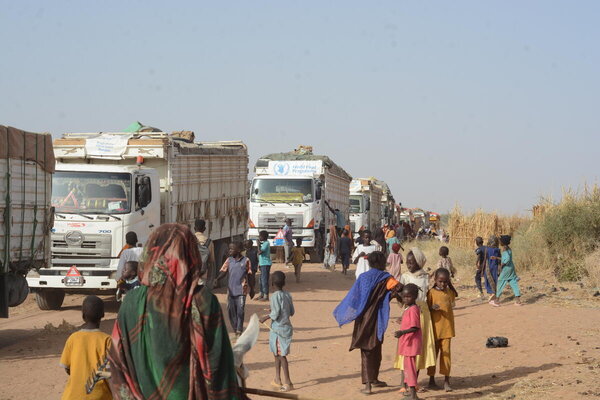 Trucks carrying WFP food assistance arrive at a displacement site in Tawila, North Darfur, in April, delivering 1,600 metric tons of food and nutrition supplies—enough to support 220,000 people. Photo: WFP/Mohamed Galal