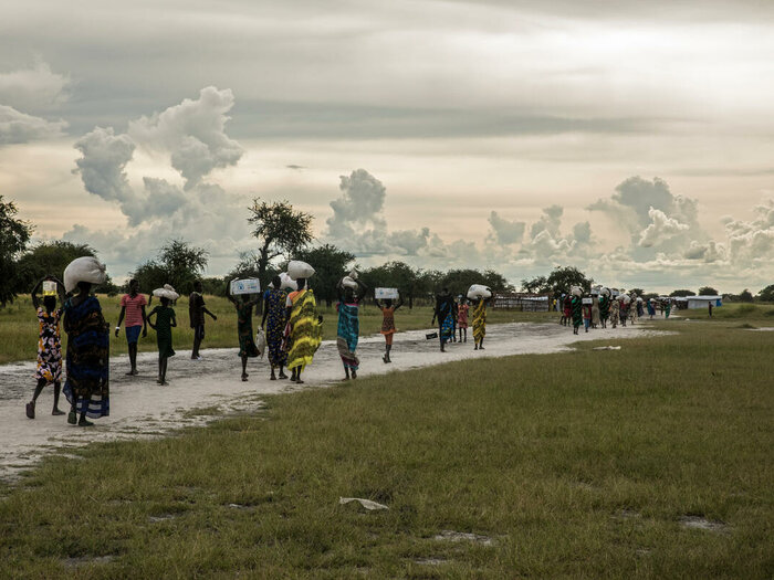 people are walking on a road