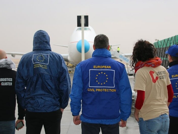 Group of people in an air strip.