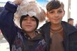 Syrian boys at a bakery supported by WFP in Aleppo. Photo: WFP/Jessica Lawson