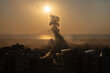 Smoke billowing from Beirut as the sun goes down. Photo: WFP/Alfredo Zuniga