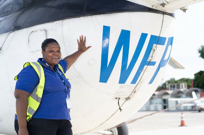 Robine is 25 years old and helps to arrange and monitor flights, as well as guide passengers and cargo onto the aircraft. Photo: WFP/Antoine Vallas
