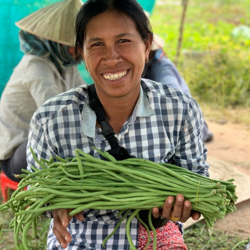 a woman is showing her harvest