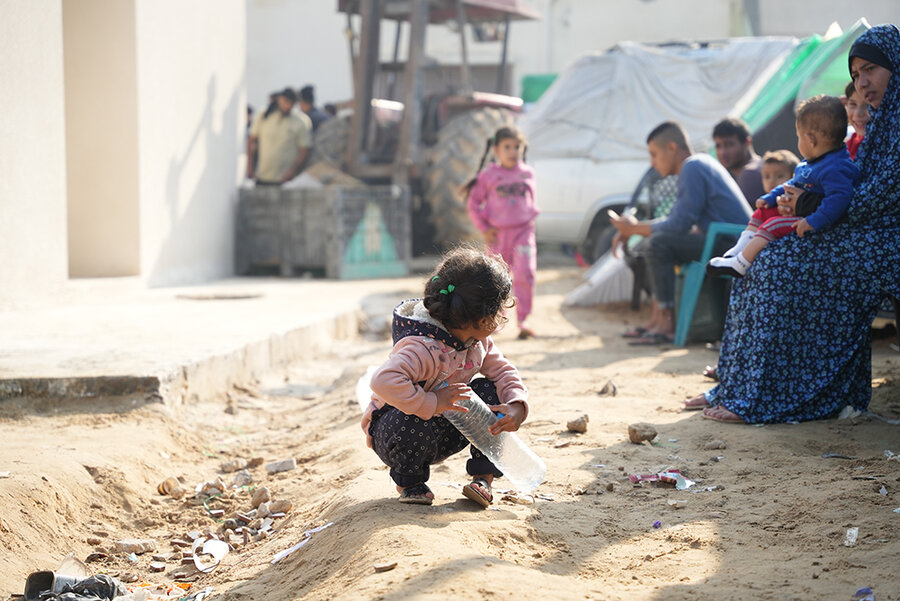A child with a plastic bottle in Gaza
