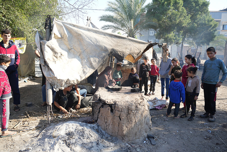 Bread baking in camp for displaced people in Gaza