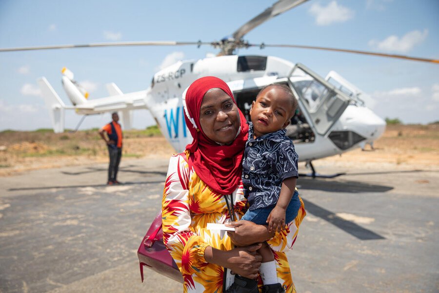 Eugenia Saide Luis, an employee of the Ibo Island Foundation, accompanied by her one-year-old son, relies on UNHAS services for their journey from Pemba to Ibo Island