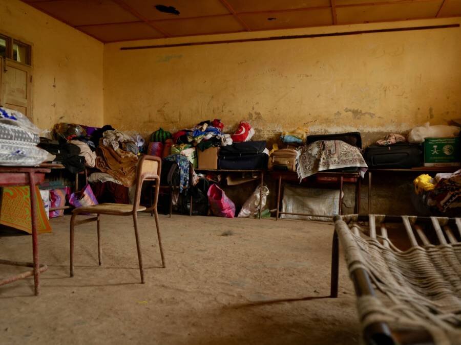 Belongings of war-displaced Sudanese at a school in Port Sudan - one of many in the eastern city now housing them. Photo: WFP/Leni Kinzli
