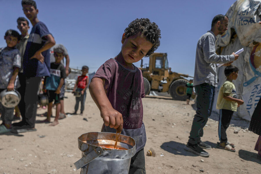 Child takes a meal in Khan Younis