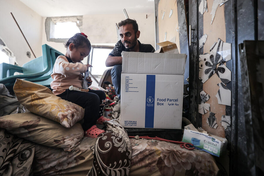 A family back in what remains of their home in Khan Younis after fleeing Rafah