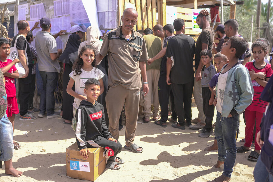 A family with a WFP box in Gaza
