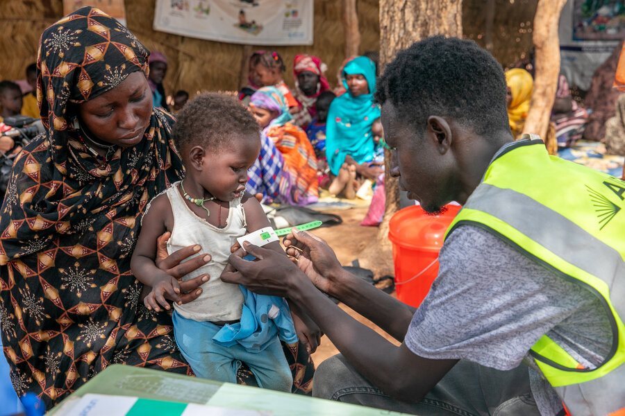 Health center staff check nutrition levels of Sudanese children at Wedweil refugee settlement in South Sudan. The war in neighbouring Sudan has deepened hunger and malnutrition countrywide. Photo: WFP/Eulalia Berlanga