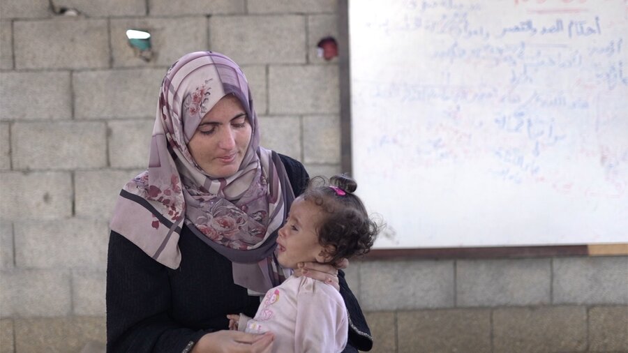 Siham Zayid with her severely malnourished daughter Jana. WFP has been delivering special nutritional foods to vulnerable people, but this support is drying up because of a supply shortage. Photo: WFP/Ali Jadallah