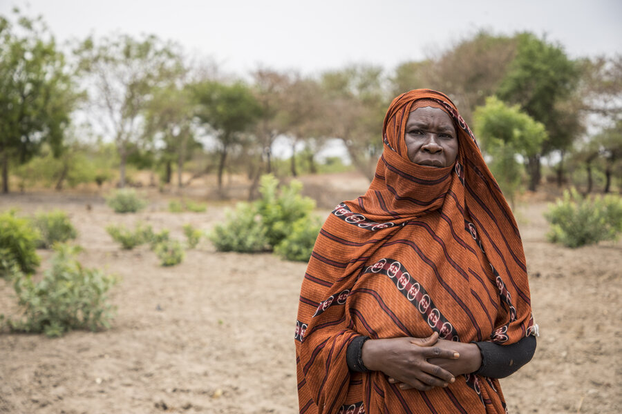 Sudanese refugee Halima next to the plot of land she is farming, which was given to her by Central African authorities. Photo: WFP/Aurore Vinot