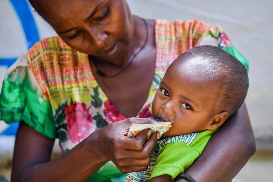In Ethiopia's Tigray region, Desta feeds her daughter special nutrient-packed peanut paste to fight malnutrition. Photo: WFP/Michael Tewelde