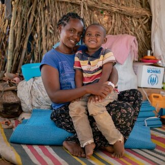 Mother and child in a tent