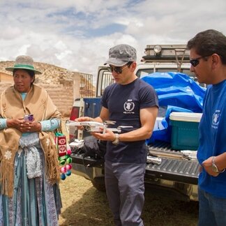 WFP staff holding a drone