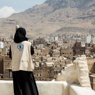 WFP staff looking to city from a hill